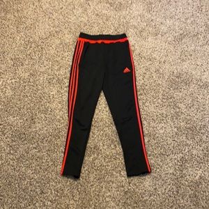 Black and red adidas pants